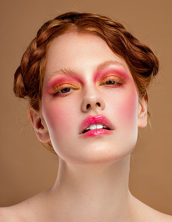 close up beauty photo of model with ginger hair, pink blush makeup and smudge lips