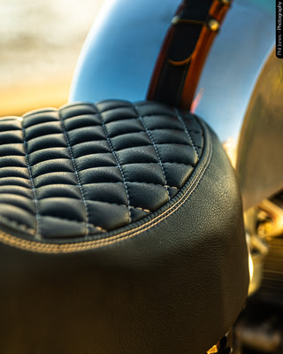 a detailed photo showing the diamond leather stitching of a motorcycle seat